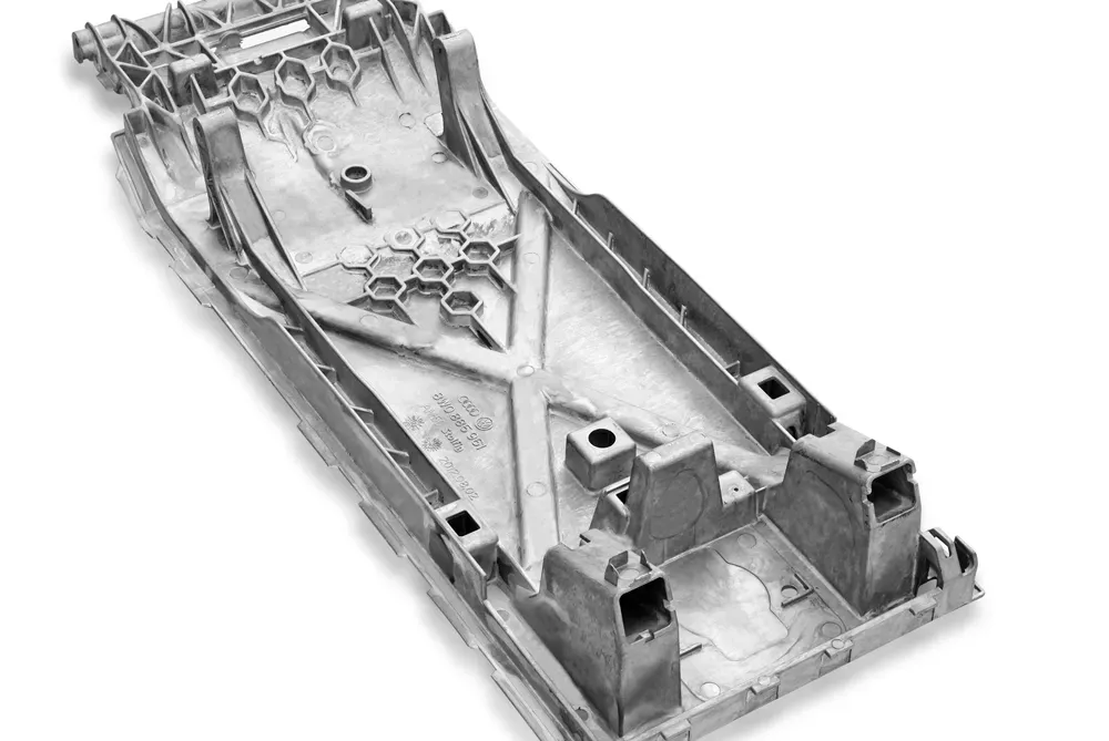 Magnesium die cast central armrest
